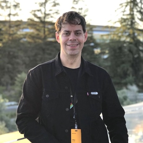 Photo of Mike Barker standing in front of Apple Park, Cupertino, California